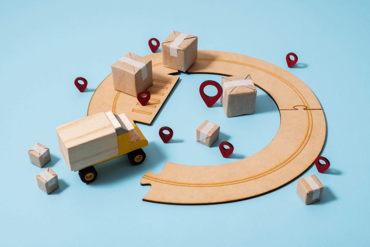 A toy truck and parcels on a looping road: a supply chain with many partners